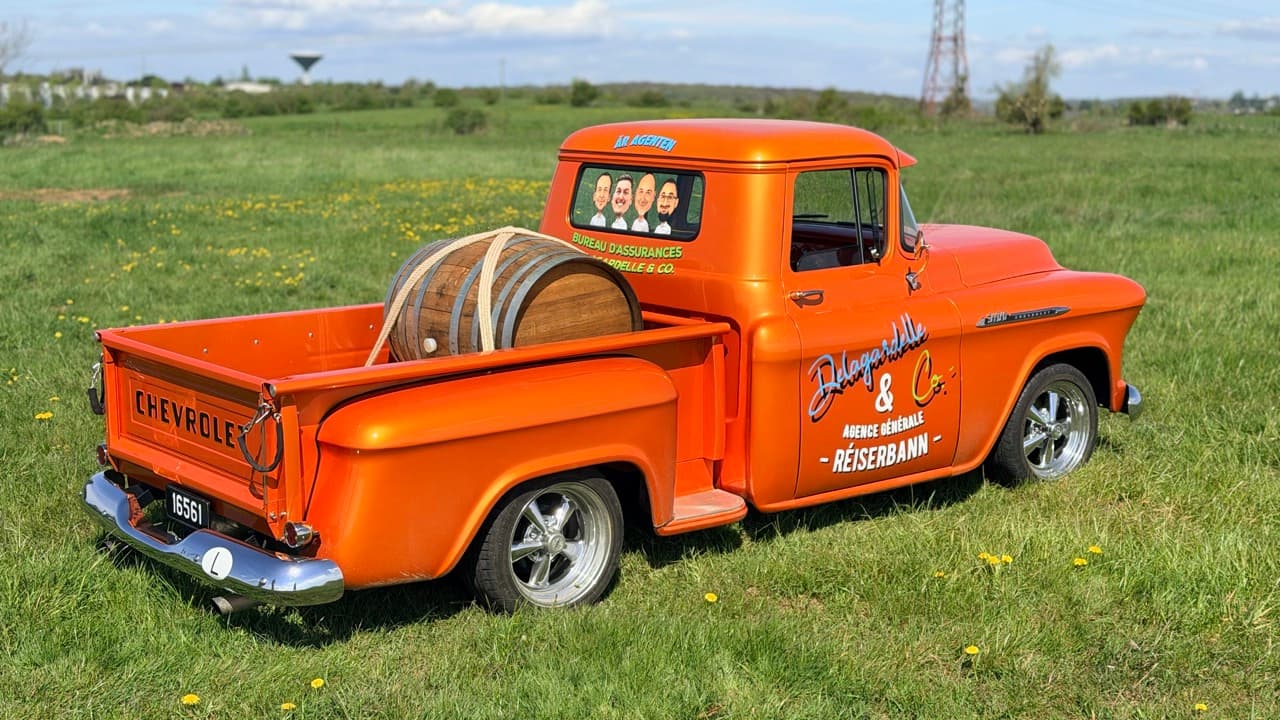 The agency's orange Chevrolet 3100